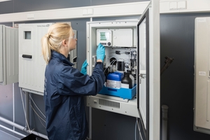 Service technician performs maintenance activities on a liquid analyzer