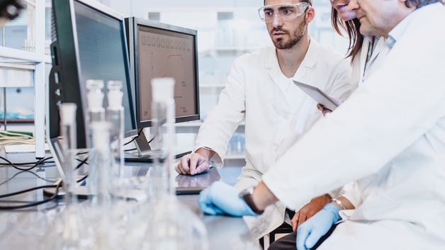 Scientists working in the laboratory looking at computer screen